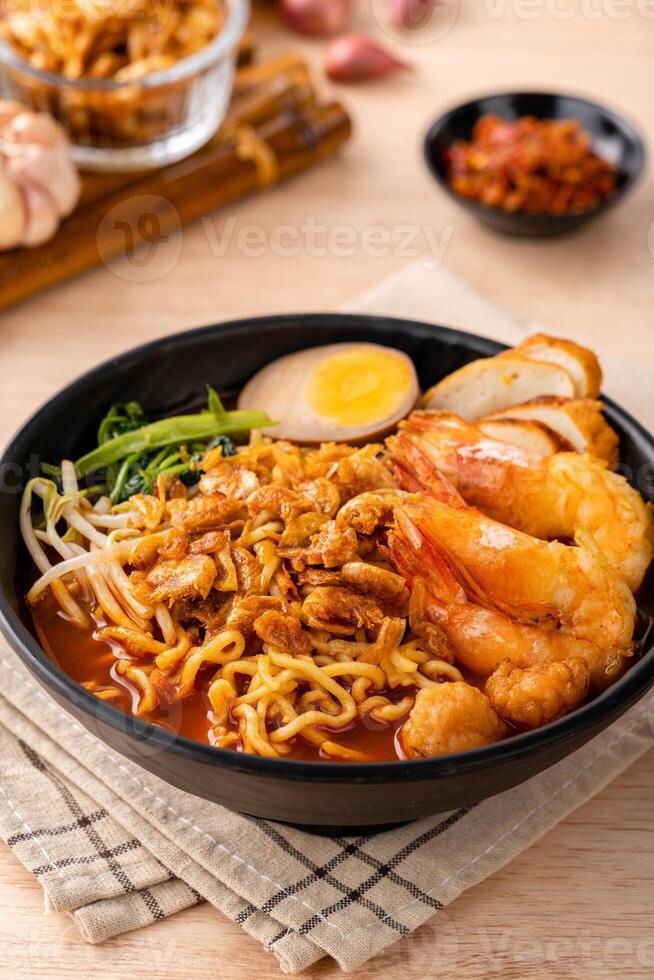 Hokkien mee or Prawn noodle are tossed in pork lard and served with fish balls, shrimp. photo