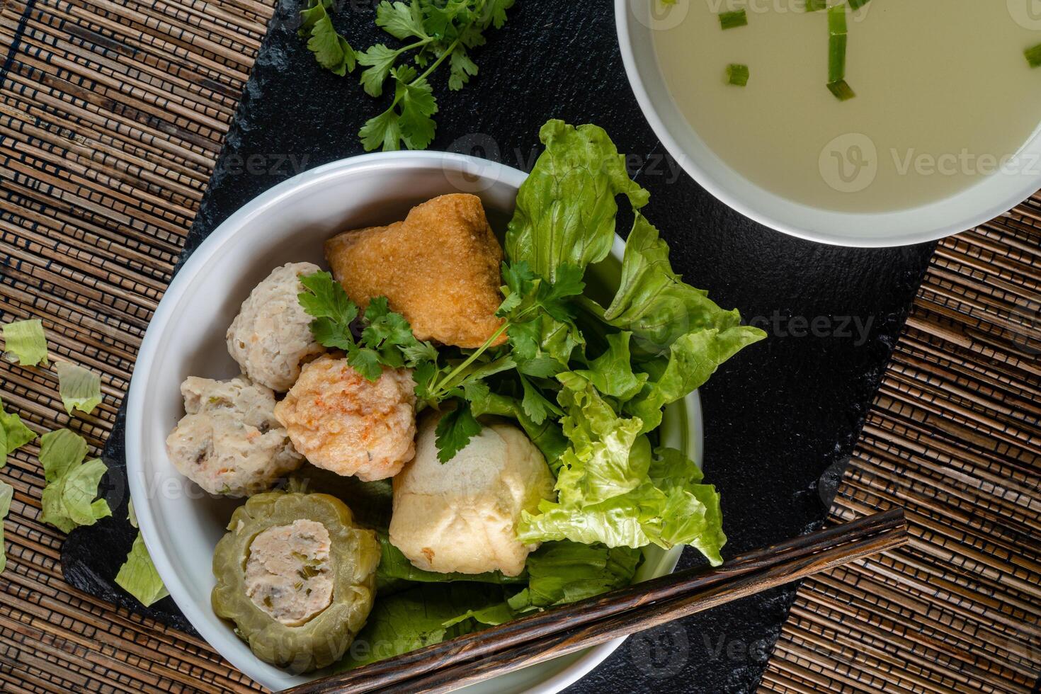 Yong tau foo , yong tau fu or Liong Tahu. is a Hakka Chinese cuisine consisting primarily of tofu filled with ground meat mixture or fish paste. photo