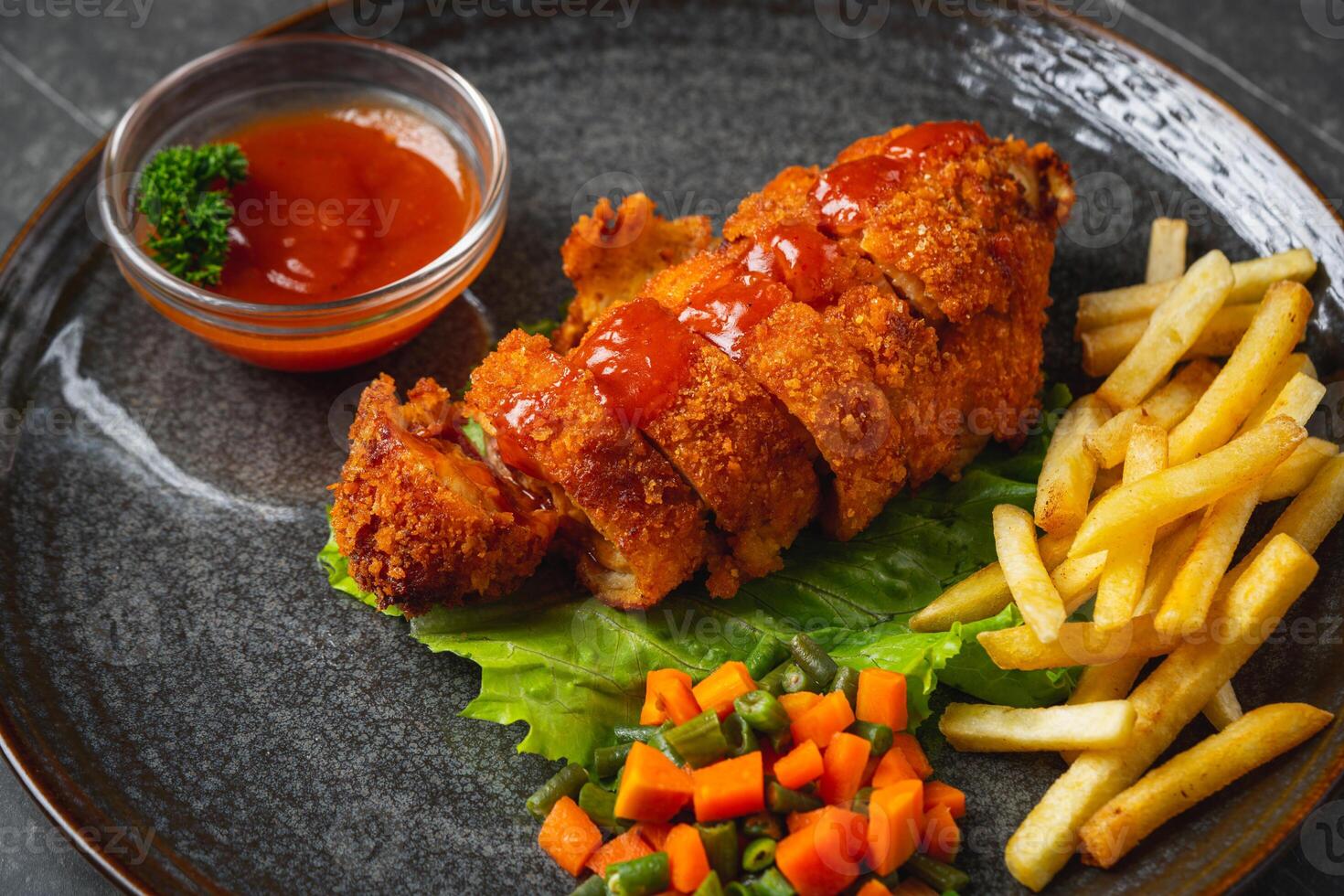 A chicken cordon bleu or schnitzel cordon bleu is a dish of meat wrapped around cheese, then breaded and pan-fried or deep fried. photo