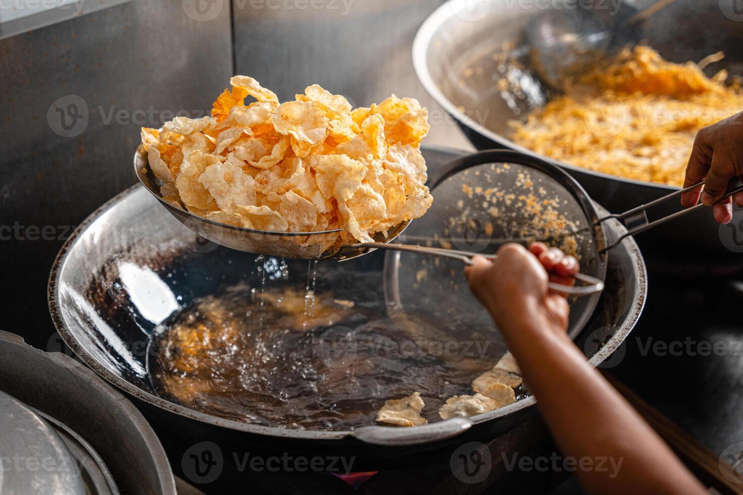 making process Emping Balado, Spicy Snacks from West Sumatra. Made from melinjo crackers, it's crunchy and sweet and spicy. photo