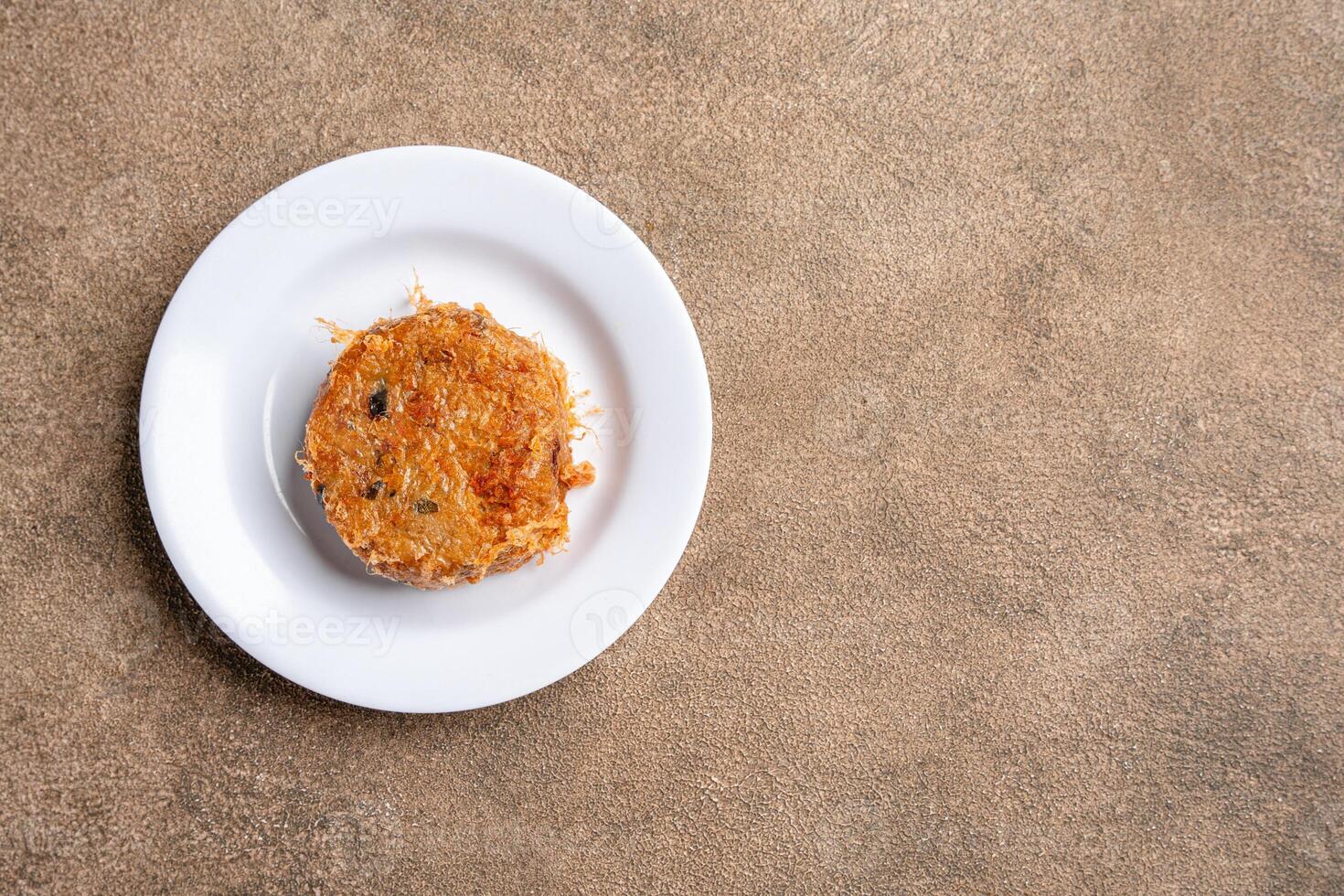 Perkedel Kentang is Potato croquette of ground meat and boiled potatoes or other starch, which then mash the potatoes together with garlic, salt, and pepper. photo