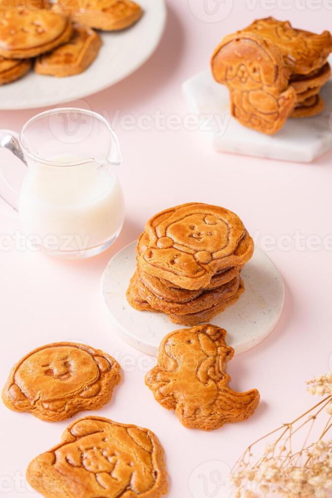 Mooncake biscuits are little sweet snacks which are like the outer layer of the mooncake. Unlike the traditional baked mooncakes, these biscuits are usually made without filling and are much thicker. photo