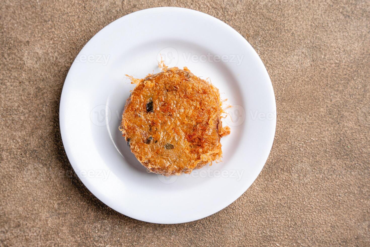 Perkedel Kentang is Potato croquette of ground meat and boiled potatoes or other starch, which then mash the potatoes together with garlic, salt, and pepper. photo