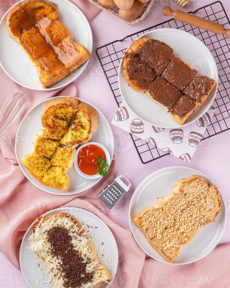 roti bakar is usually prepared as a sandwich of grilled white bread with a filling, consumed both as a light breakfast and a common street food. photo