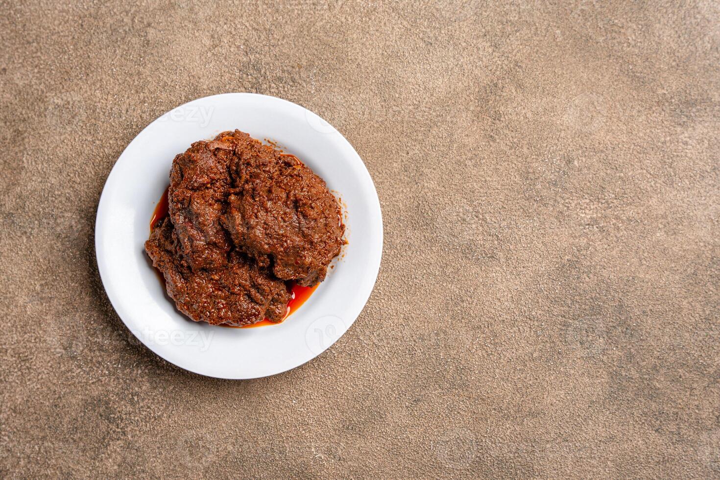Beef Rendang is a Minang dish originating from the Minangkabau region in West Sumatra, Indonesia. photo
