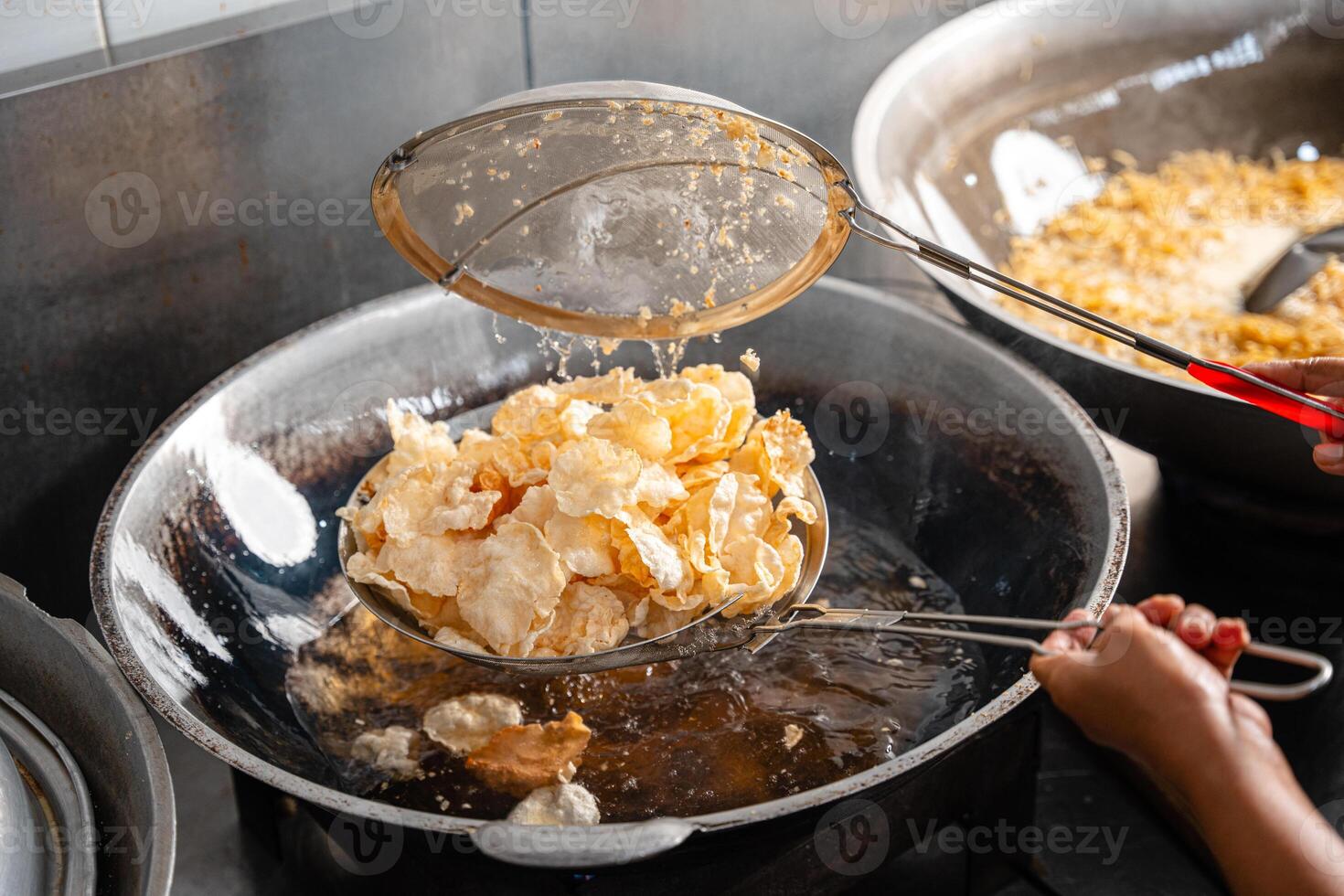 making process Emping Balado, Spicy Snacks from West Sumatra. Made from melinjo crackers, it's crunchy and sweet and spicy. photo