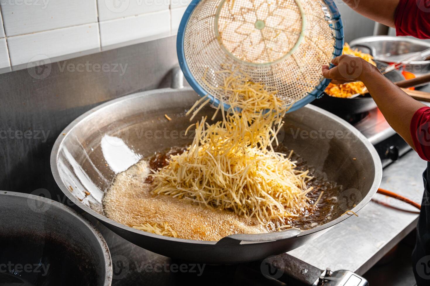 Dried potato or potato mustofa is the term for dry match-shaped potatoes stir-fried with Indonesian spices. photo