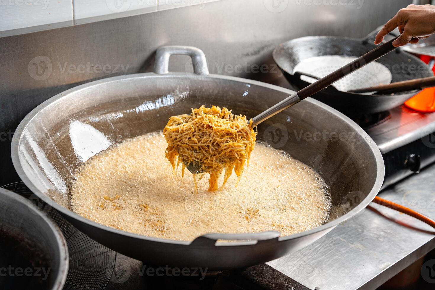 Dried potato or potato mustofa is the term for dry match-shaped potatoes stir-fried with Indonesian spices. photo