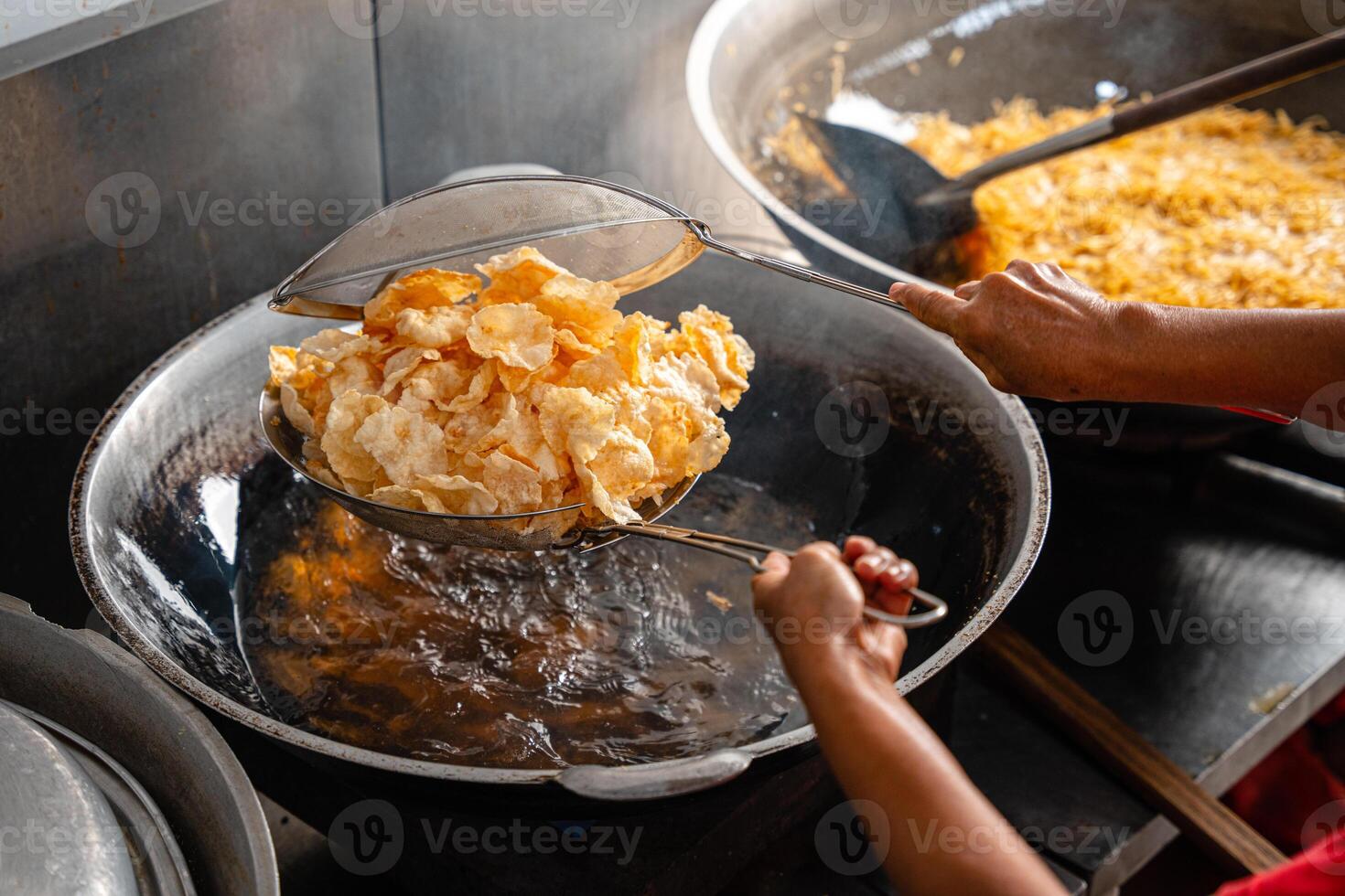making process Emping Balado, Spicy Snacks from West Sumatra. Made from melinjo crackers, it's crunchy and sweet and spicy. photo