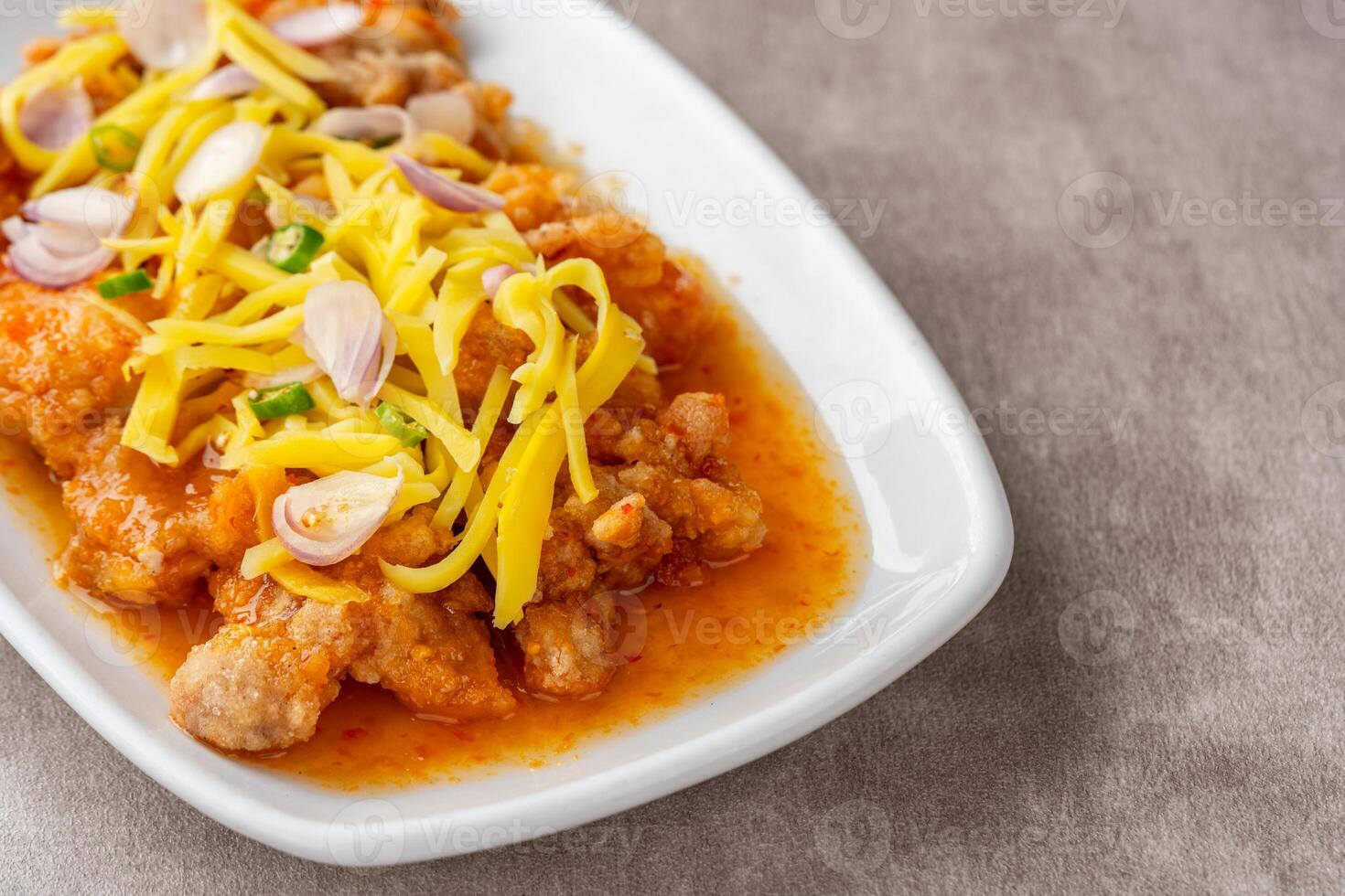 crispy chicken with mango sauce or Ayam Saus Mangga. The taste is savory spicy and a little sweet. photo