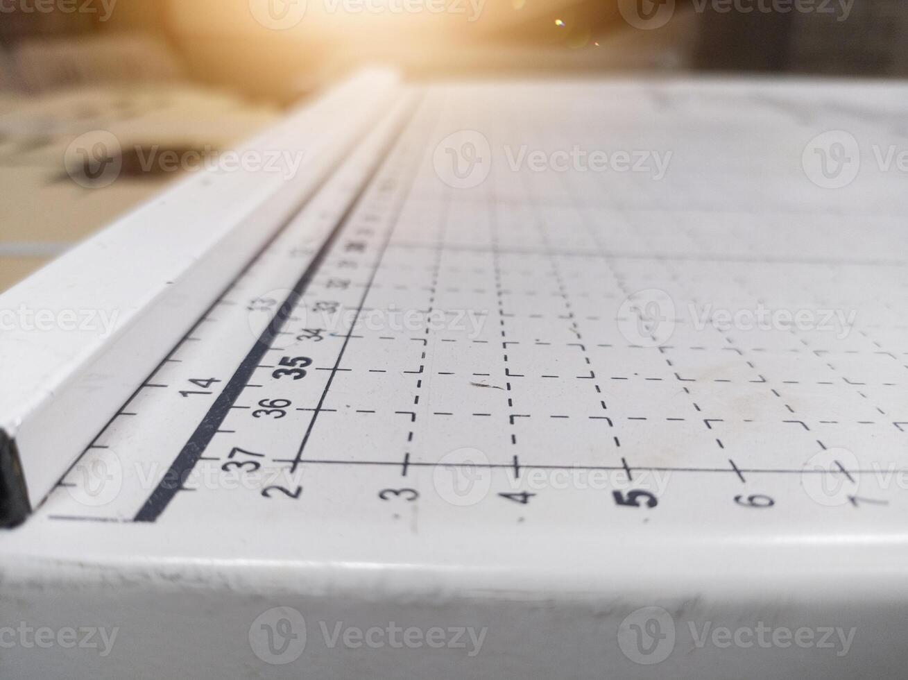 Close up the paper cutter with measuring scale, industrial paper conceptual. photo