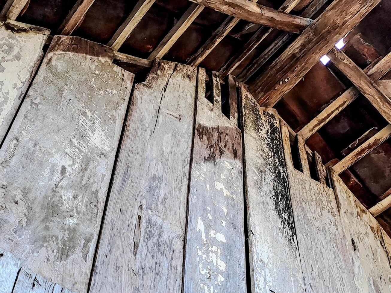 features a rustic wooden ceiling with exposed beams and aged planks photo
