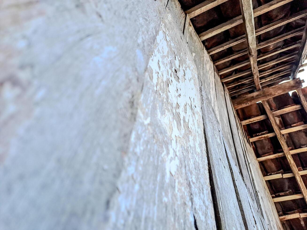 features a rustic wooden ceiling with exposed beams and aged planks photo