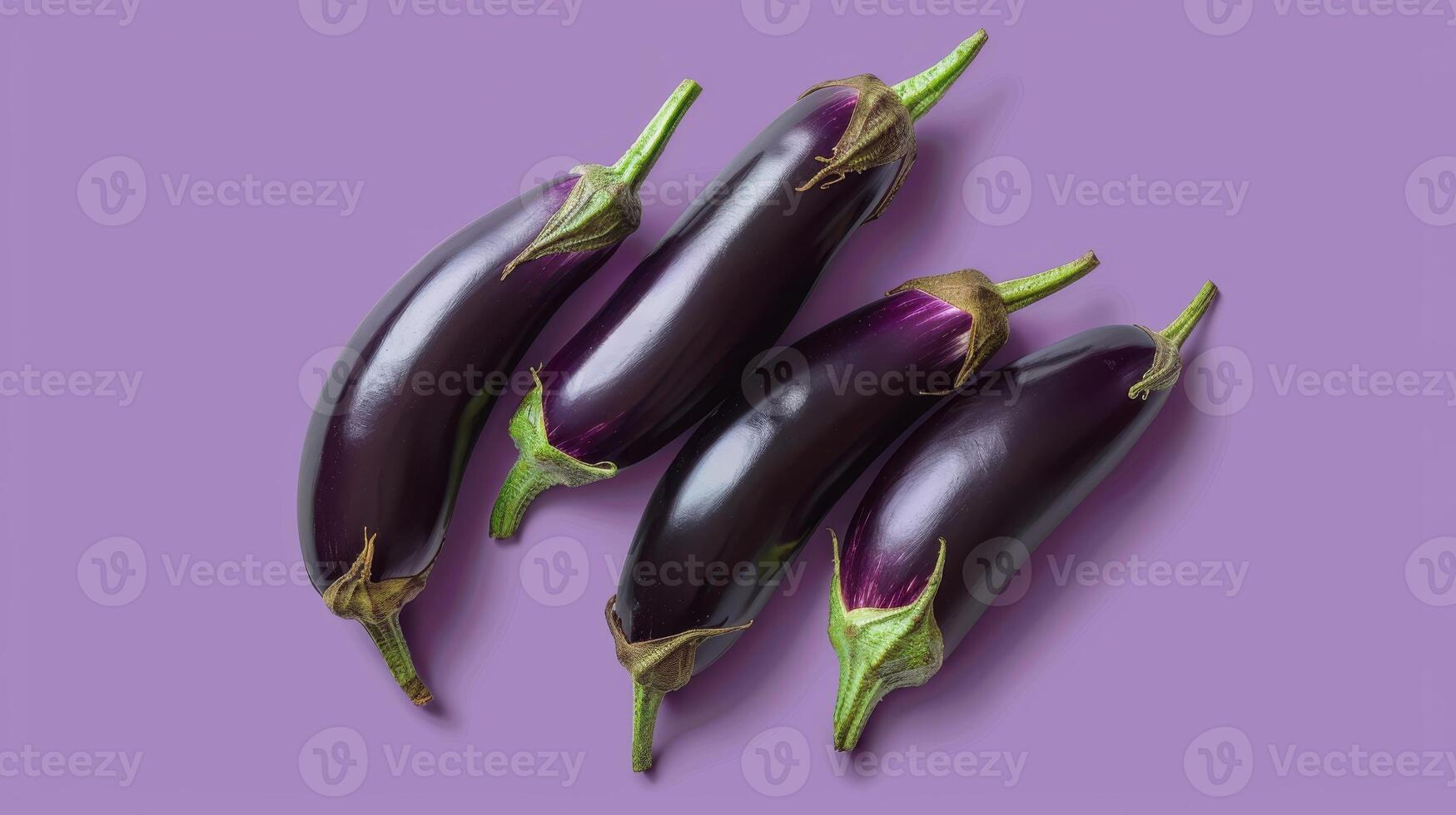 A Quartet of Eggplants Arranged on a Lavender Background photo