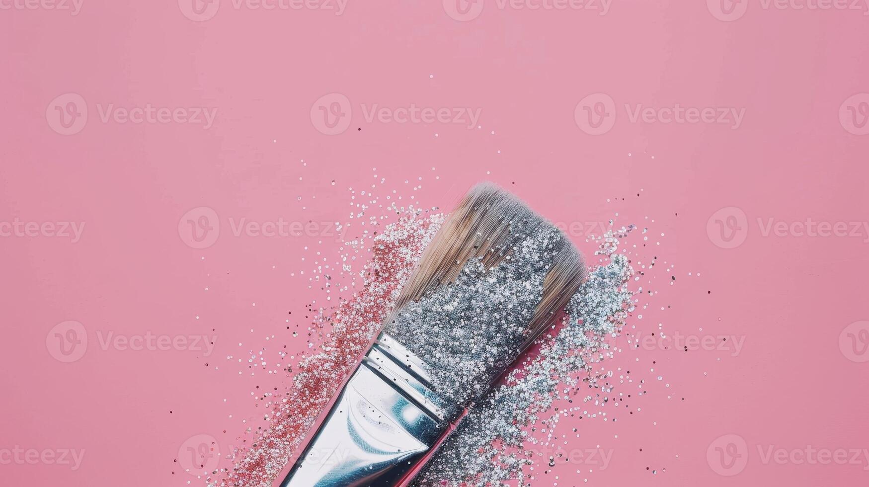 A Silver Glitter Brush on Pink Background photo