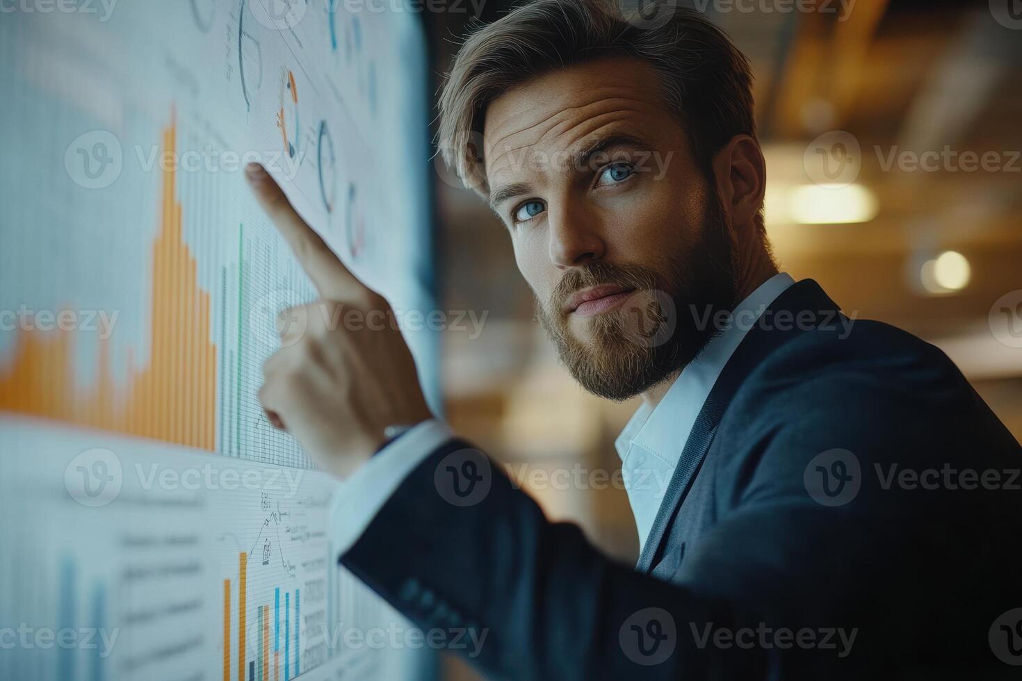 Professional man analyzing business data in modern office photo