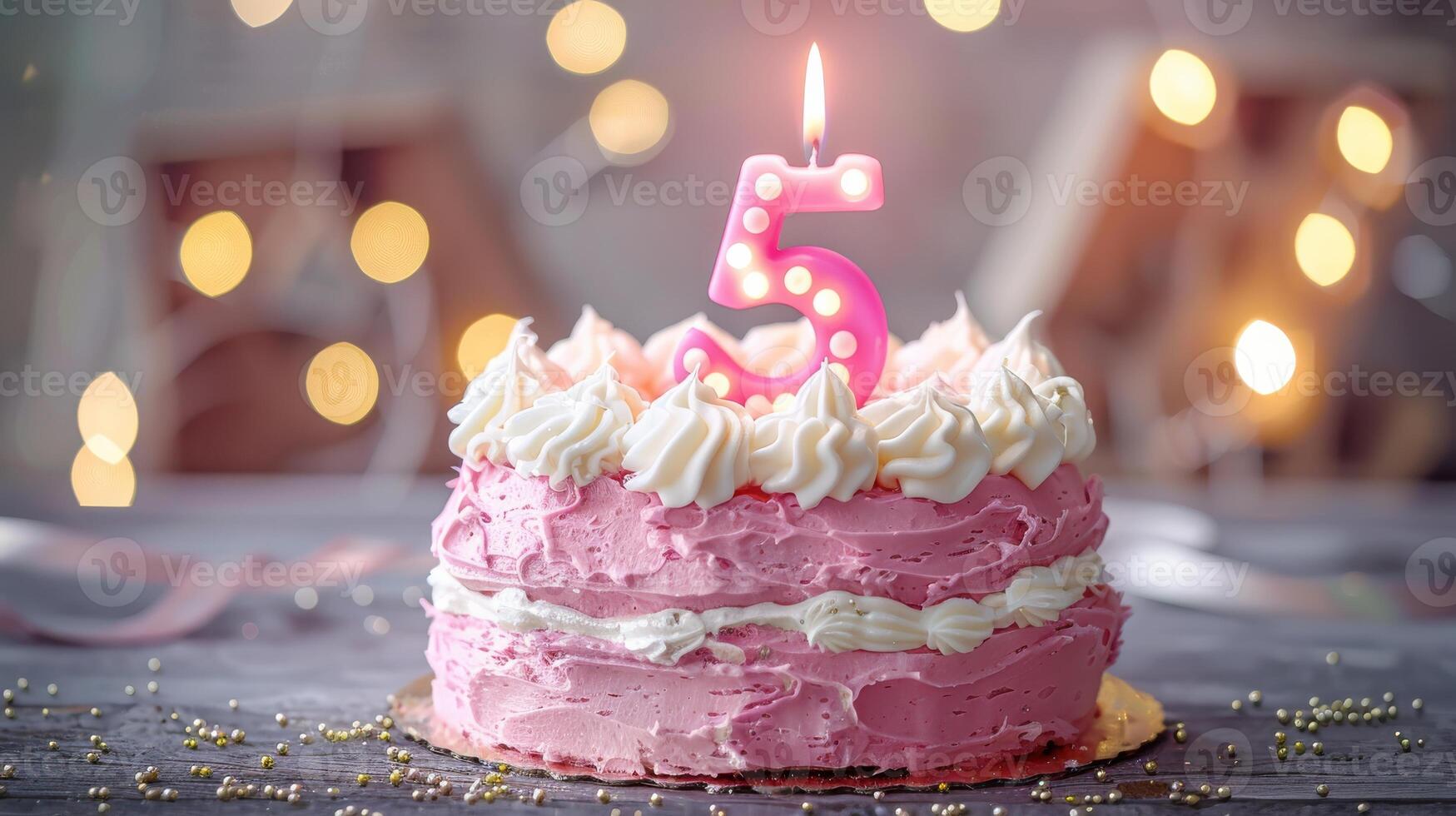 A Pink Birthday Cake With A Sparkling Number Five Candle photo