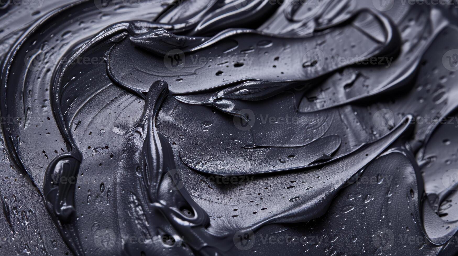 The Black Swirl of a Creamy Dream A Close-Up of a Smooth and Textured Substance photo