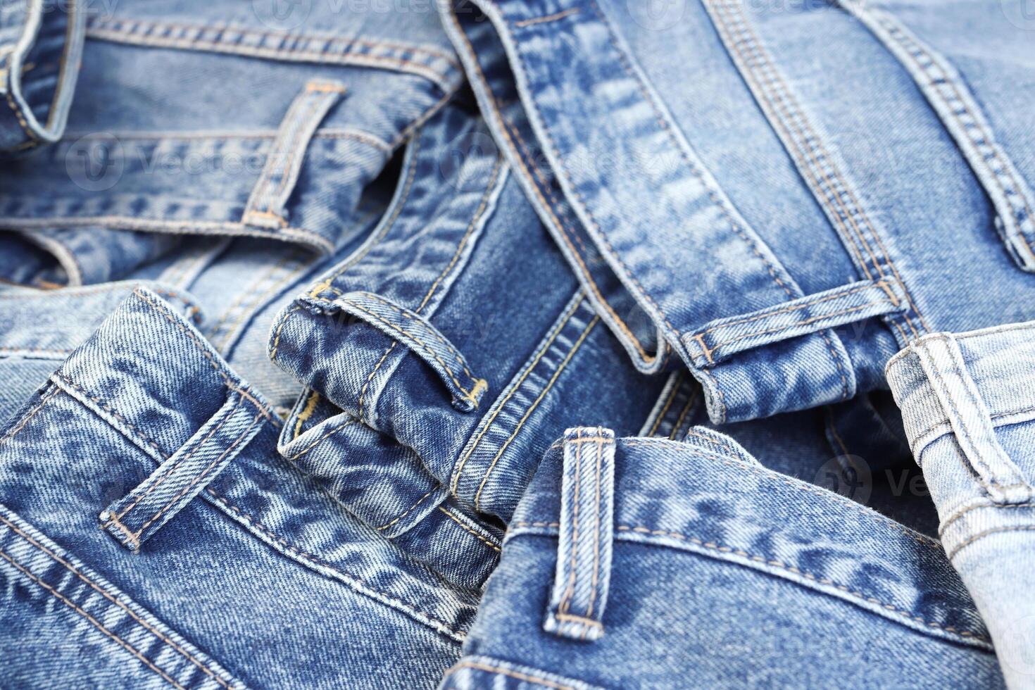 beautiful fashion jeans Stacked in layers at the jeans store photo