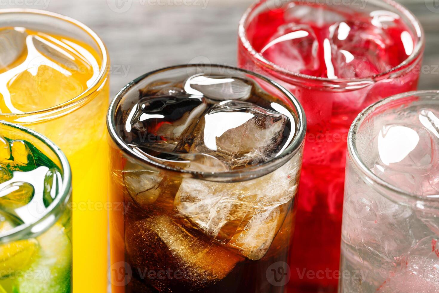Soft drinks and fruit juice mixed with soda high in sugar have a negative effect on physical health photo