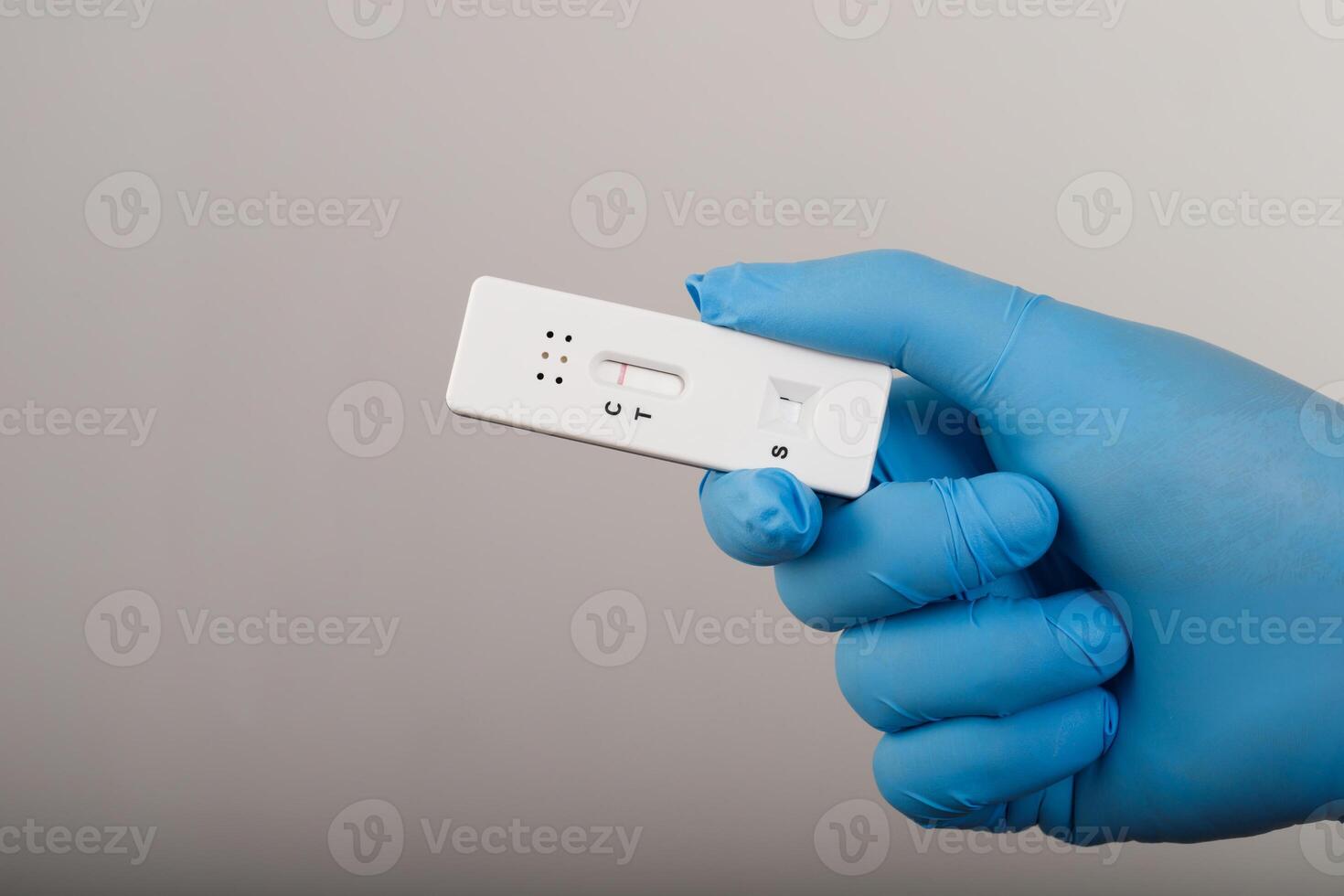 Doctor with Covid-19 test kit from the lab at the hospital photo