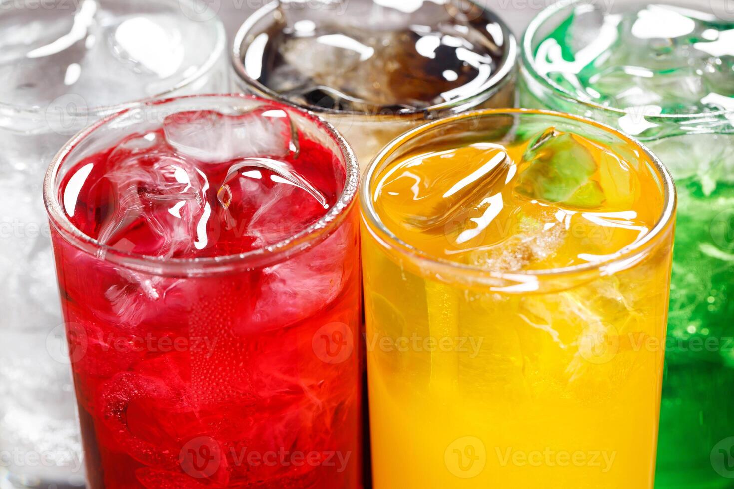 Soft drinks and fruit juice mixed with soda high in sugar have a negative effect on physical health photo