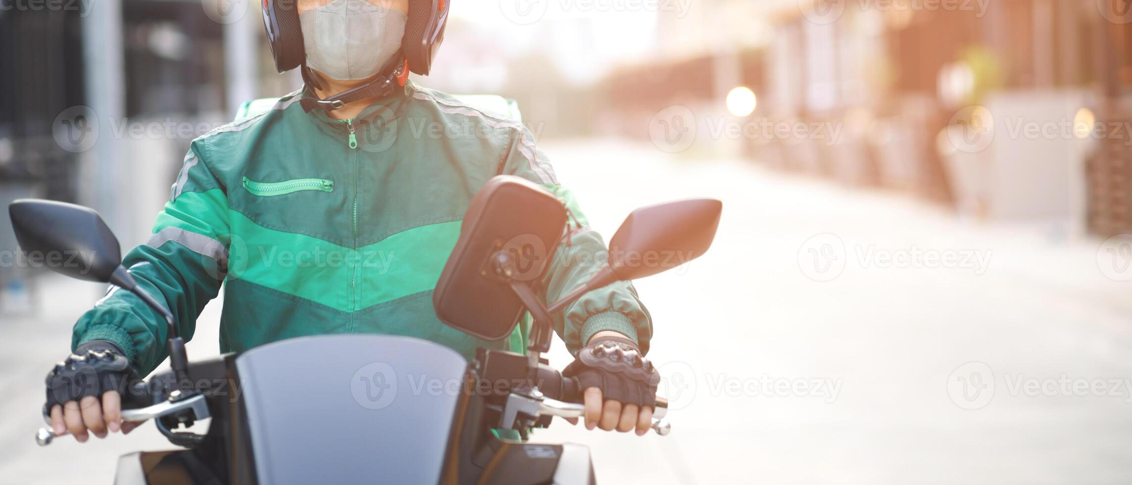 Rider delivers fast food, delivered to your home. photo