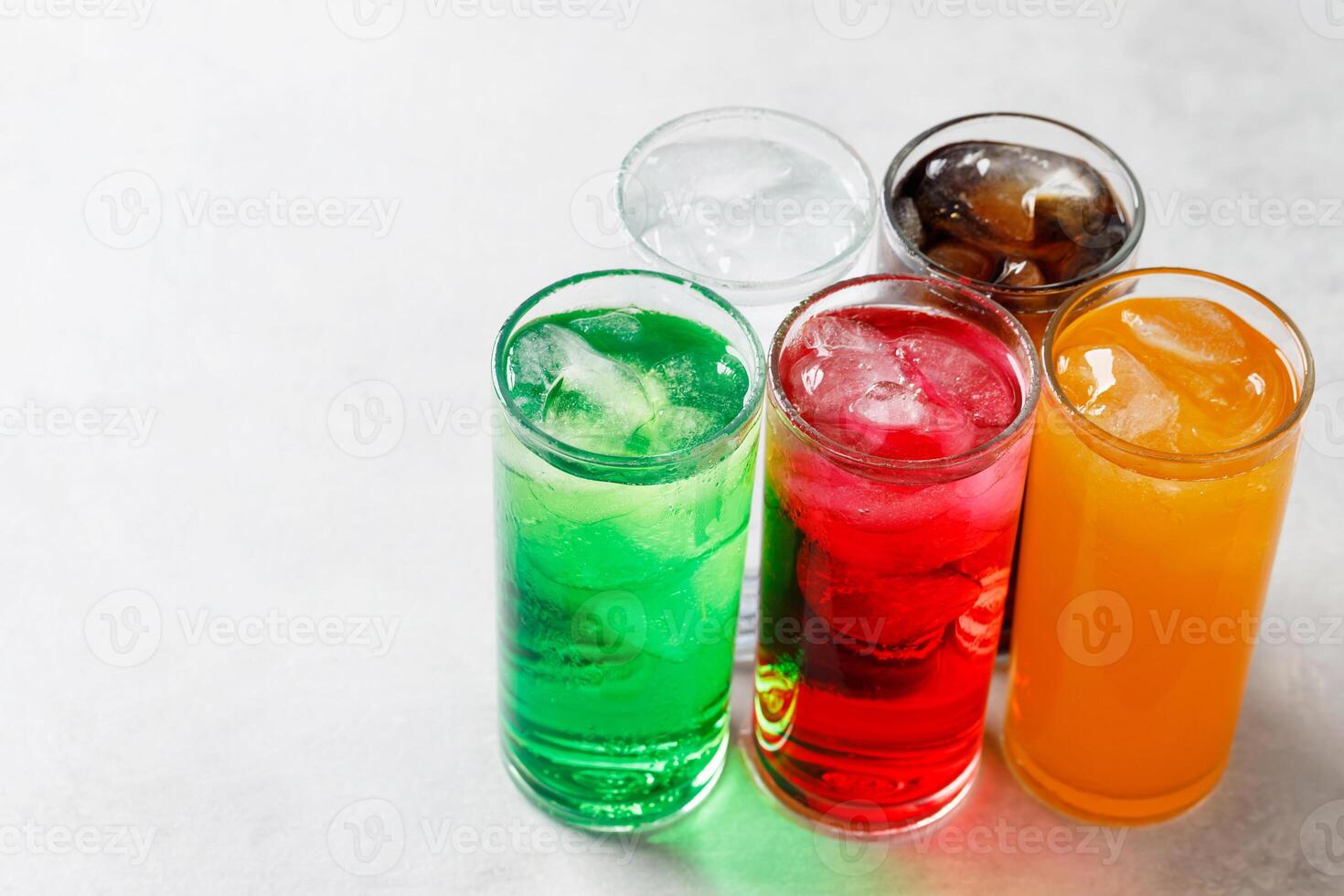 Soft drinks and fruit juice mixed with soda high in sugar have a negative effect on physical health photo