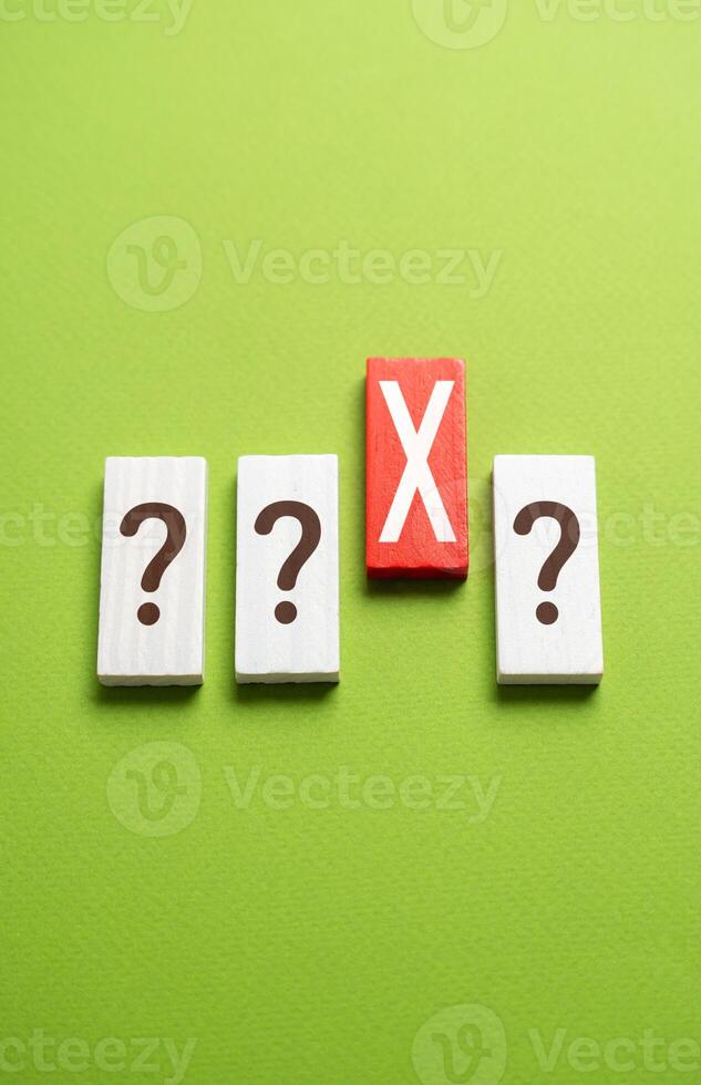 Question marks and red X. Test. Choose the wrong answer. Mistake correction. Potential risks. Problem warning. photo