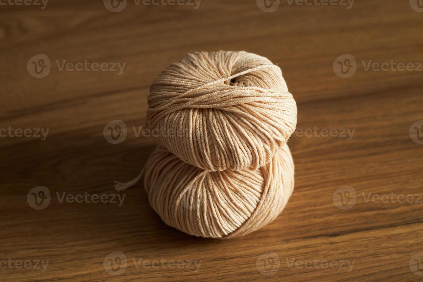 Two soft skeins of yarn on the table photo