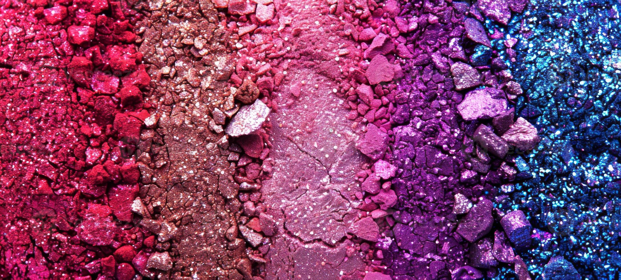 A close-up top view of crushed pink and purple eyeshadow powders, creating a vibrant texture and color gradient. Concept of beauty products, cosmetics, and makeup artistry. Background, banner photo