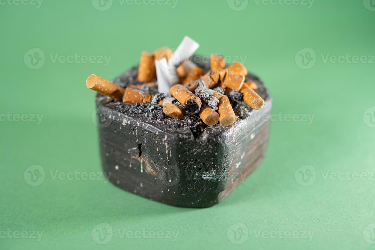 A small black box with cigarettes and a lighter photo