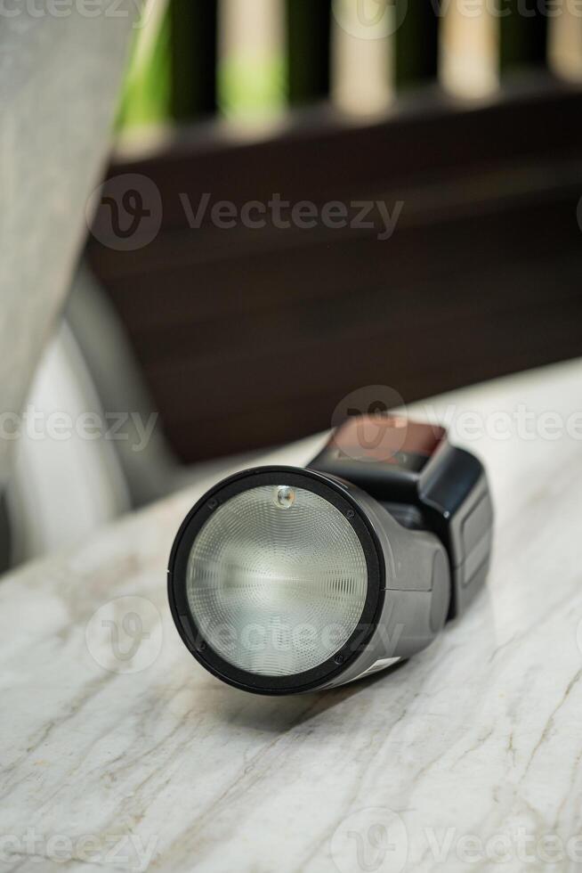 A flashlight on a table photo