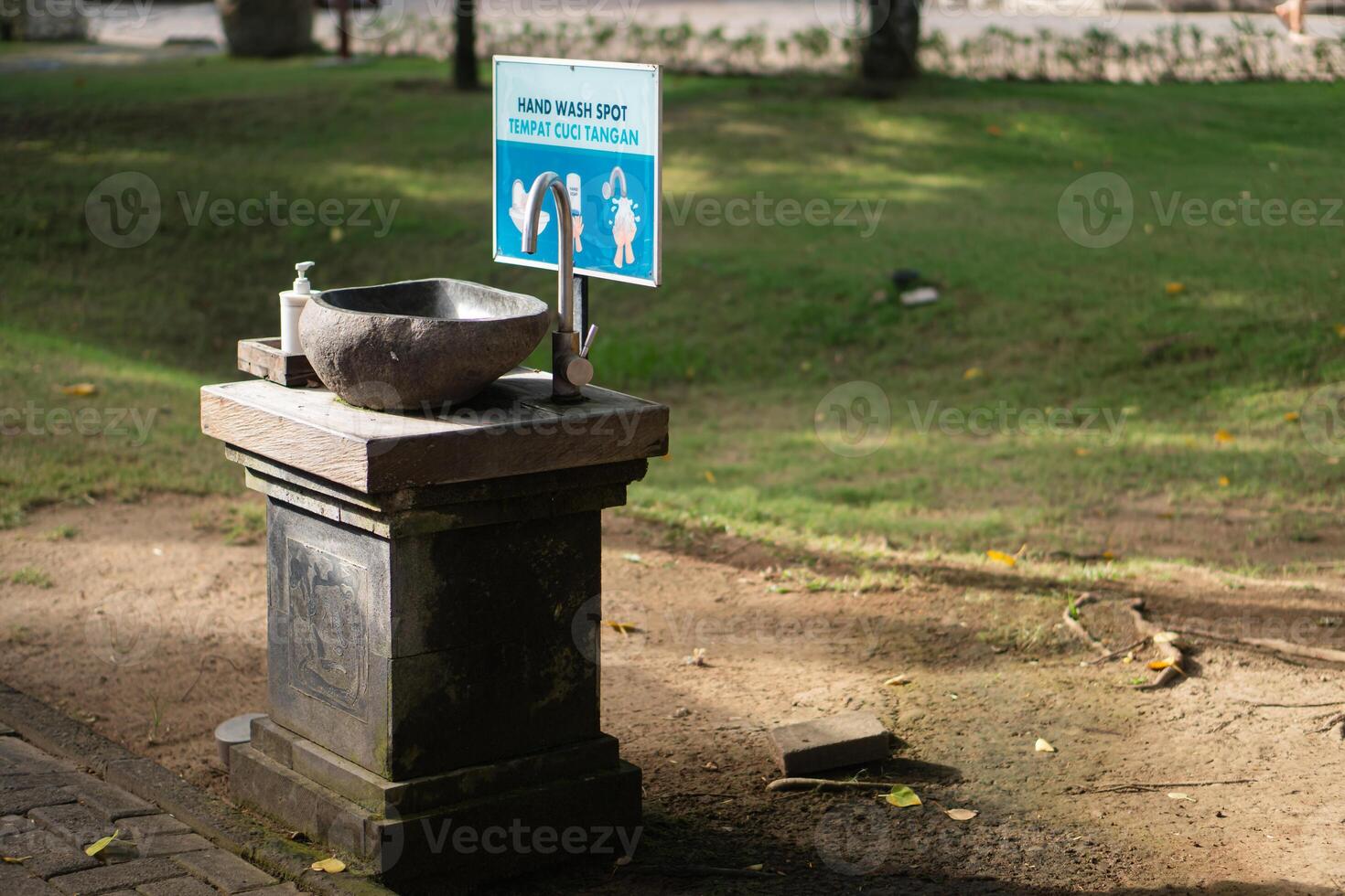 A small water fountain in a park photo