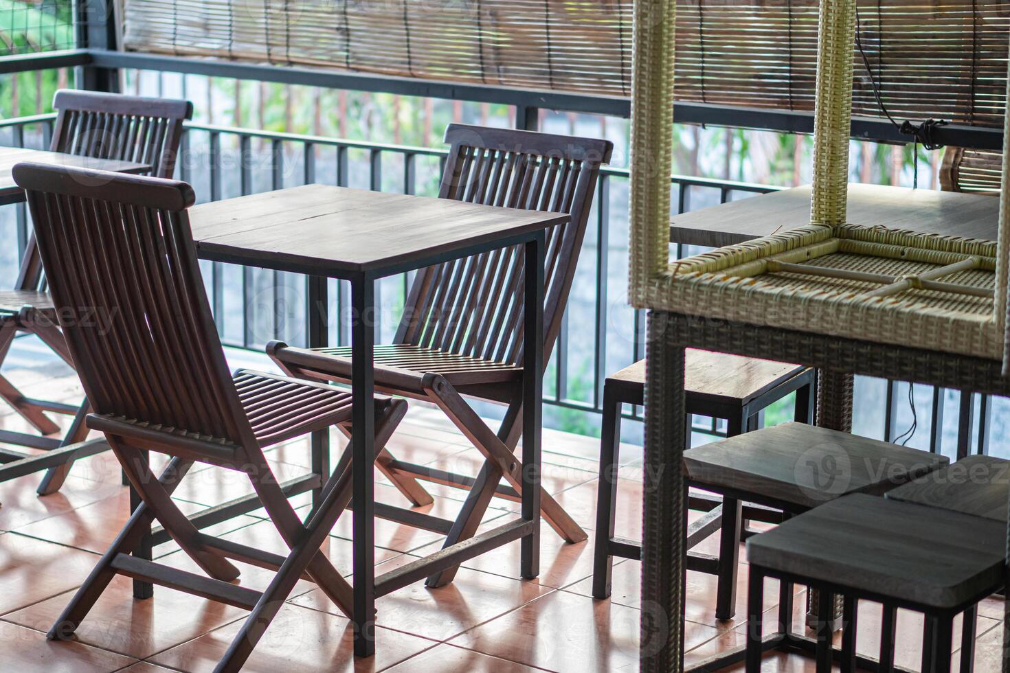 A table and chairs on a patio photo