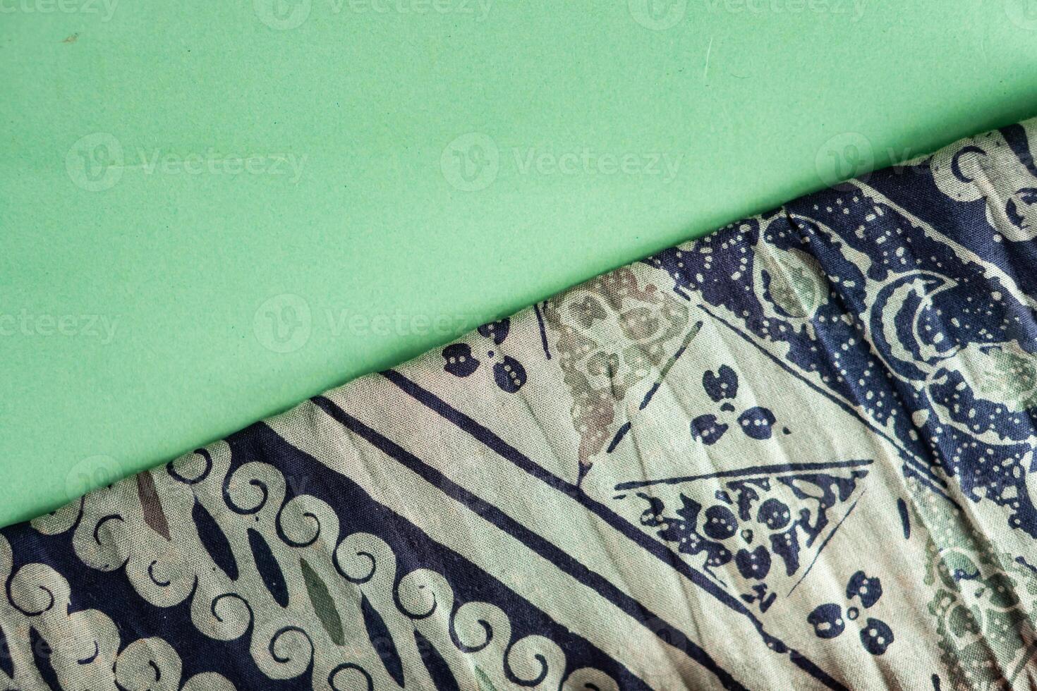 A green background with a blue and white pattern photo