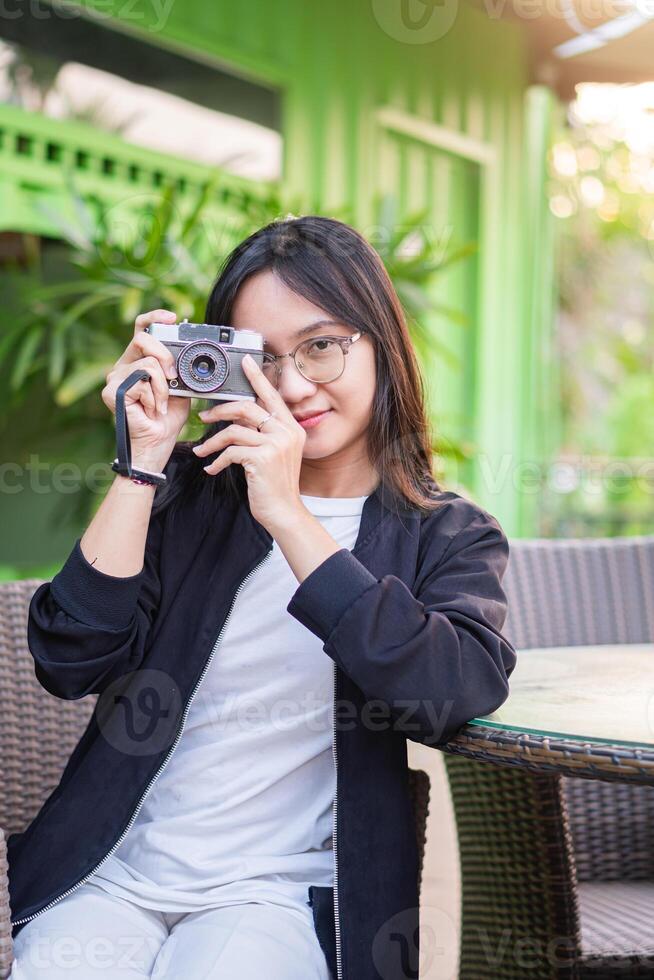 A woman taking a photo with a camera