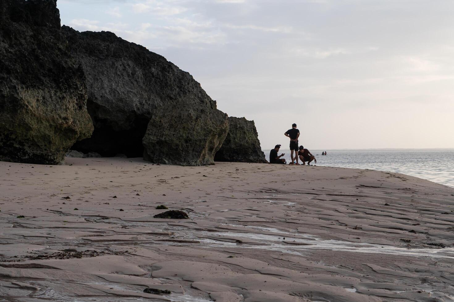 A man and his dog on a beach photo