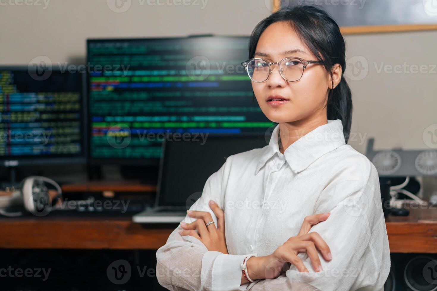 Confident Young Woman in Tech Office photo