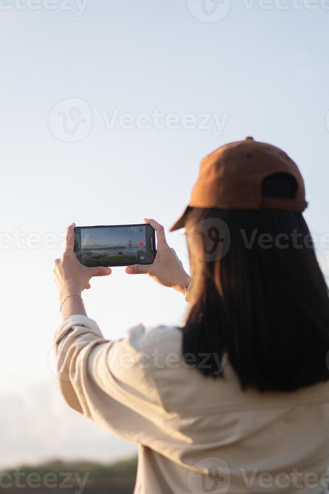 Woman Taking Photos with Smart phone Outdoors