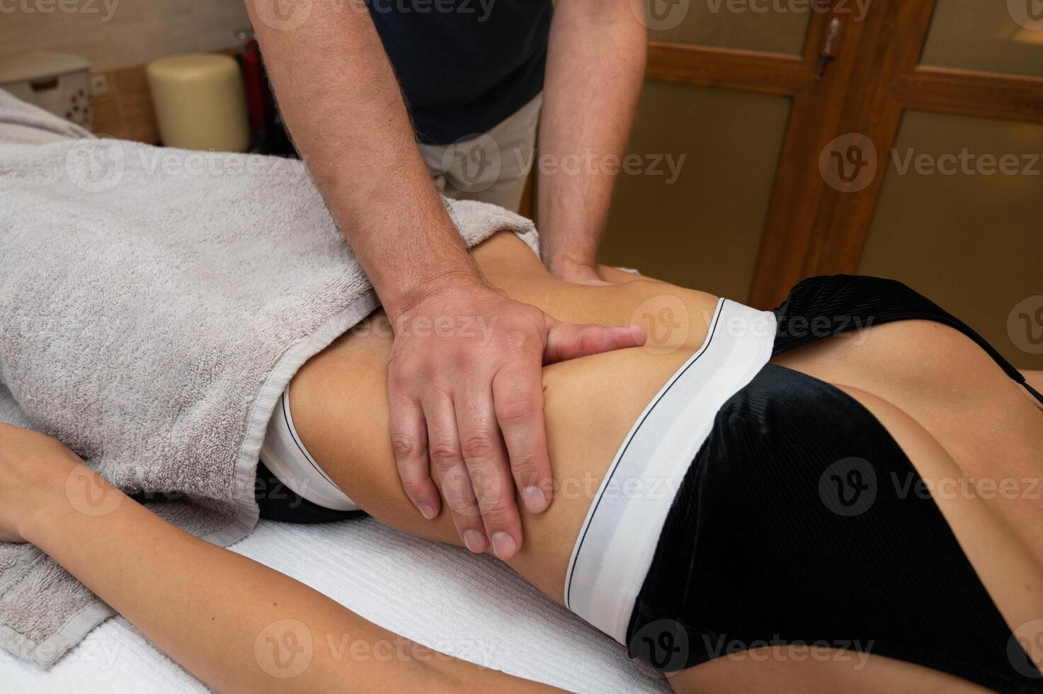 Woman getting massage in spa salon photo