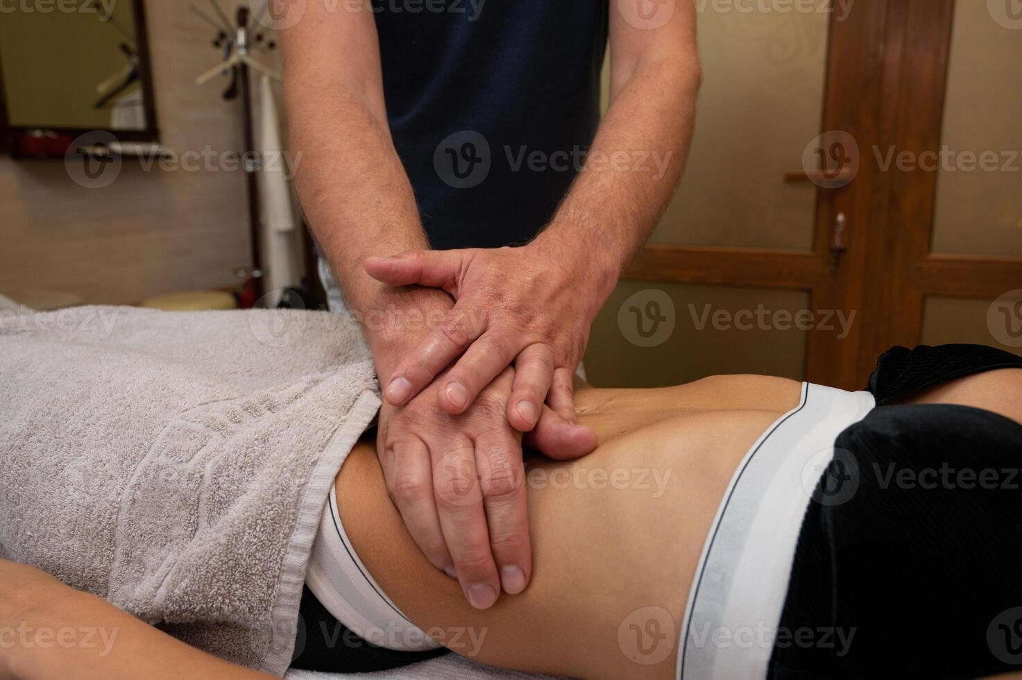 Woman getting massage in spa salon photo