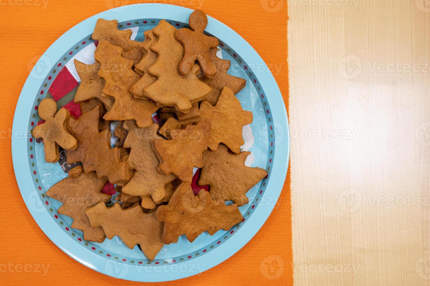 Plate with unglazed Christmas cookies photo