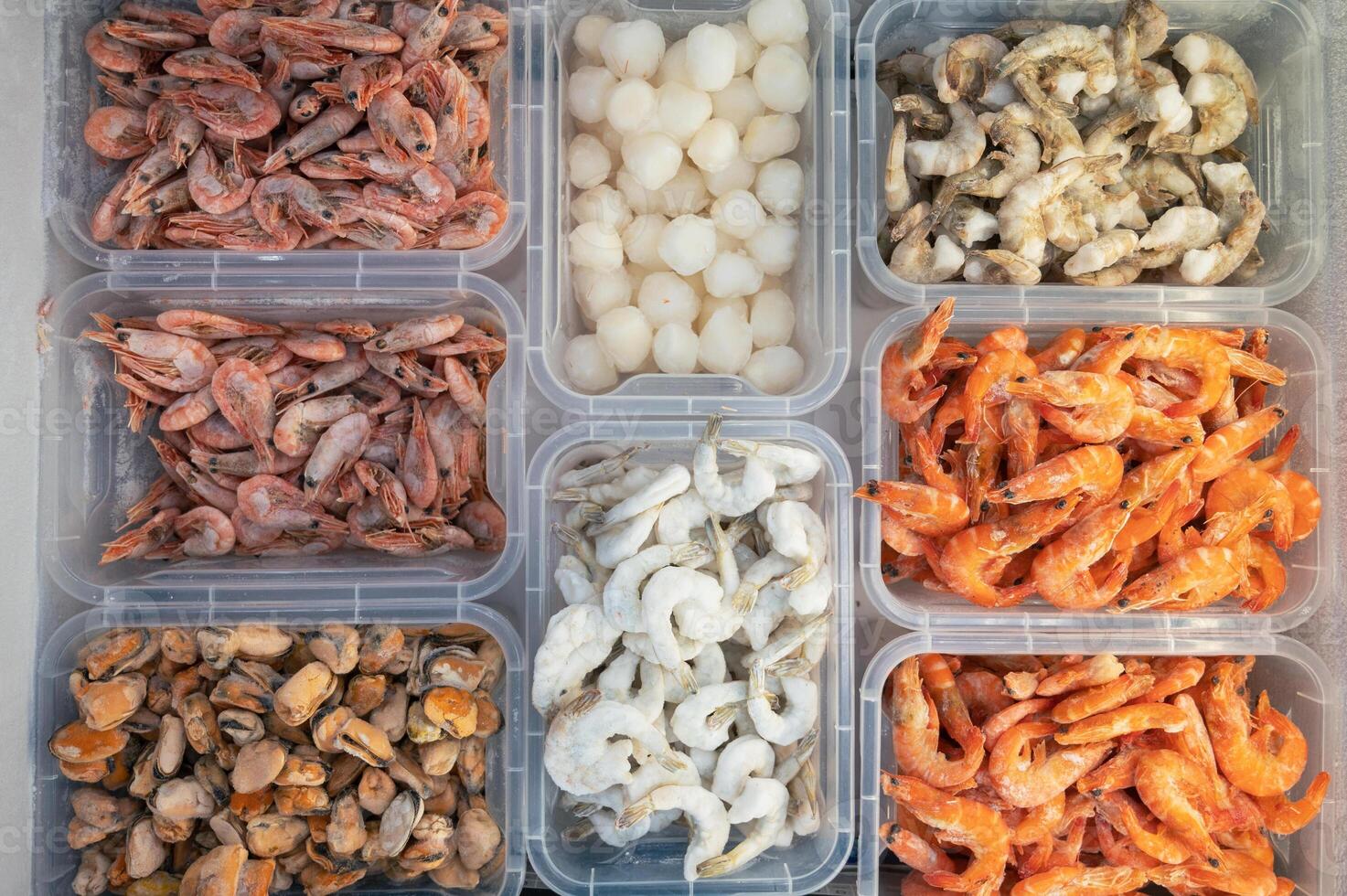Frozen Seafood in fridge at the fish market. photo