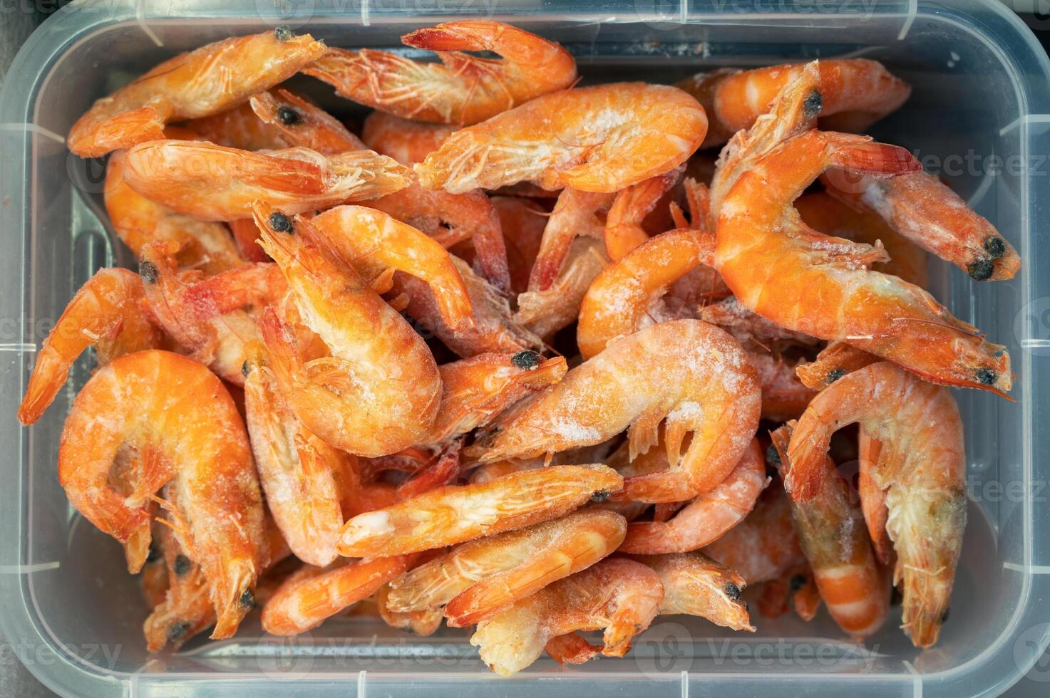 Frozen shrimp in fridge at the fish market. photo