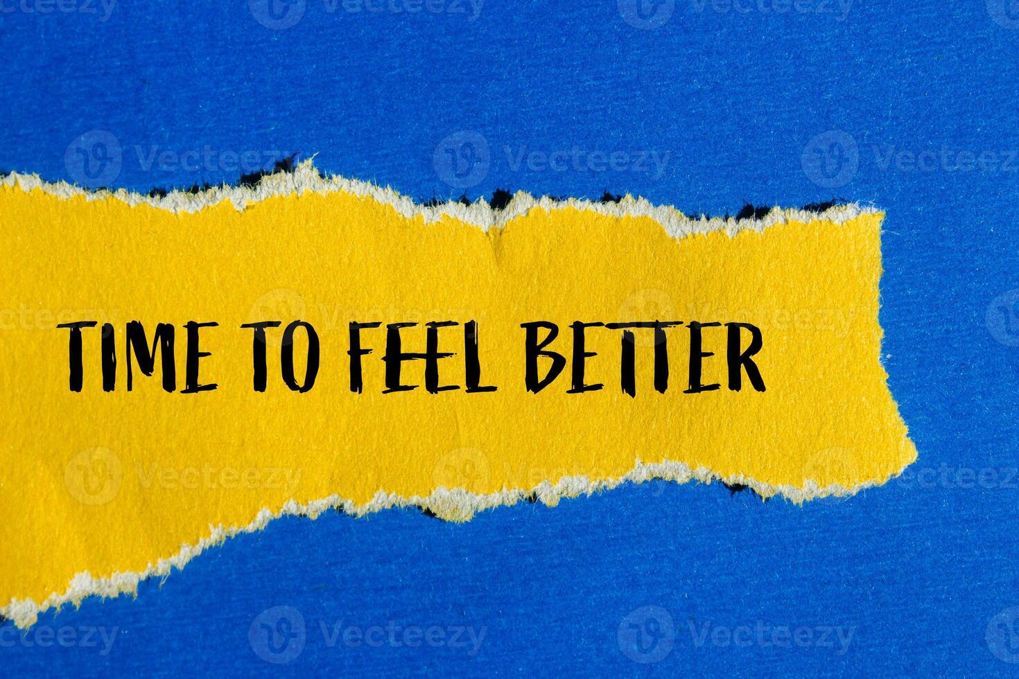 Time to feel better message written on ripped torn yellow paper with blue background. Conceptual time to feel better symbol. Copy space. photo