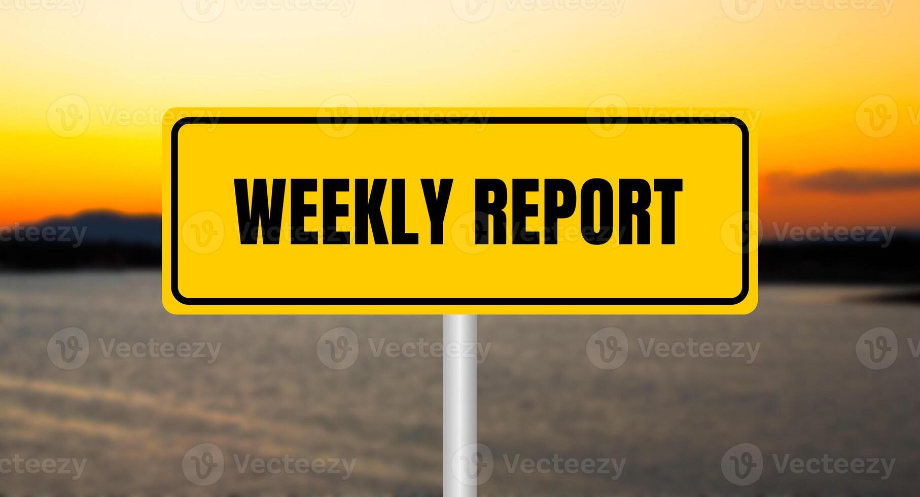 Weekly report message written on yellow sign with blurry lake background. Conceptual weekly report symbol. Copy space. photo