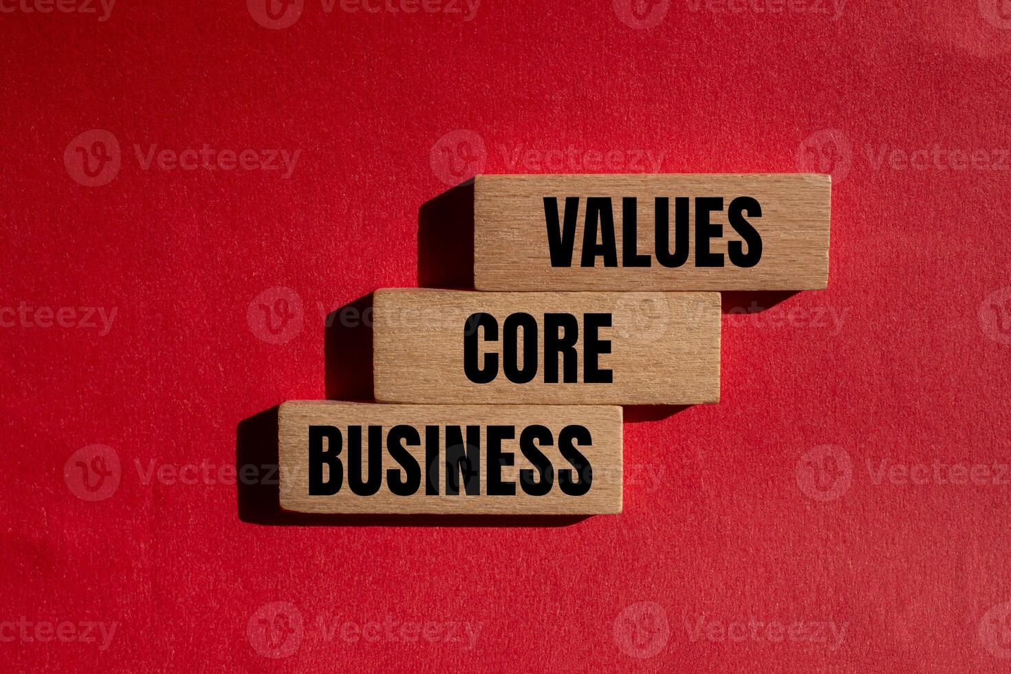 Three wooden blocks with the words values core business photo