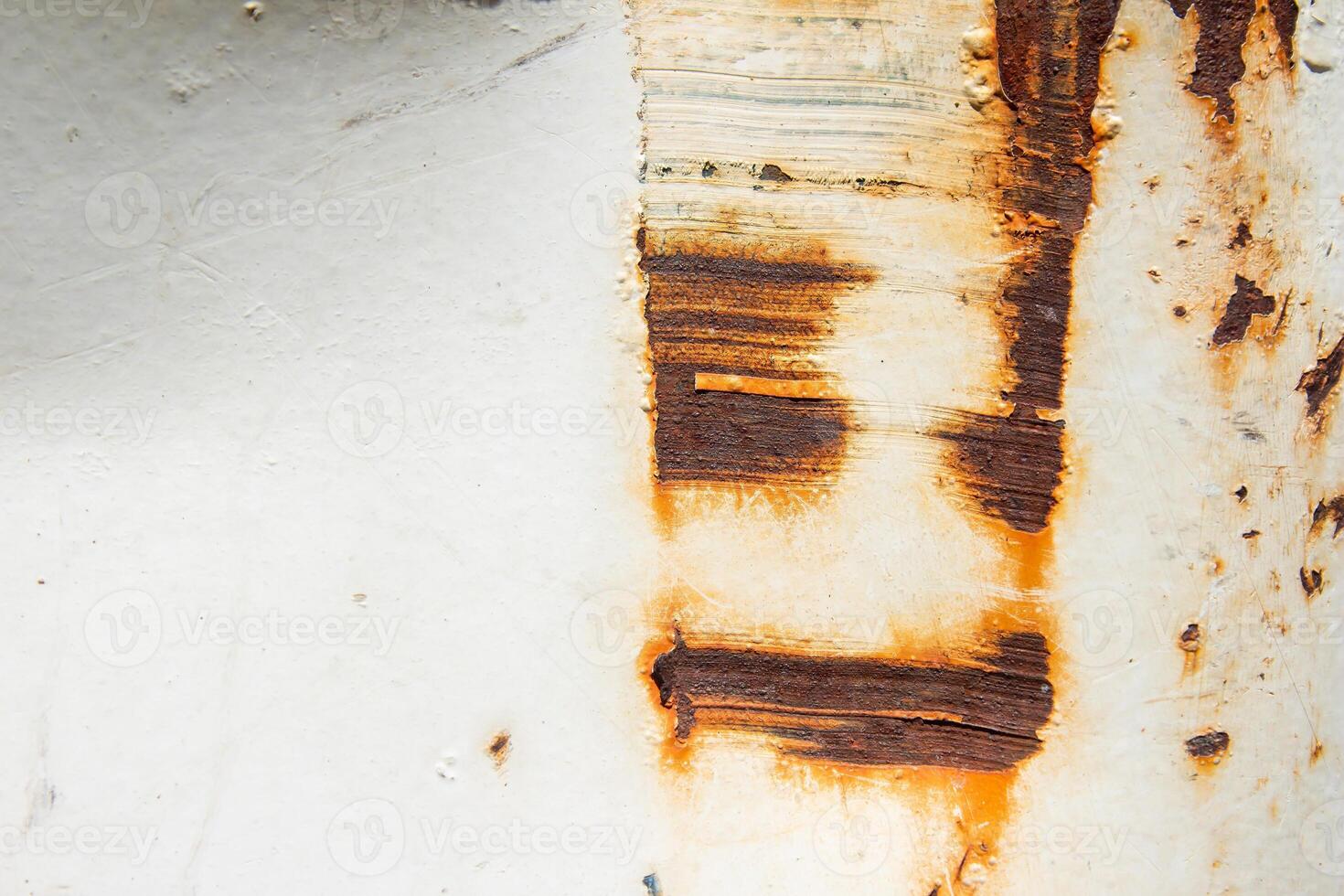 A close up of a rusty white wall photo
