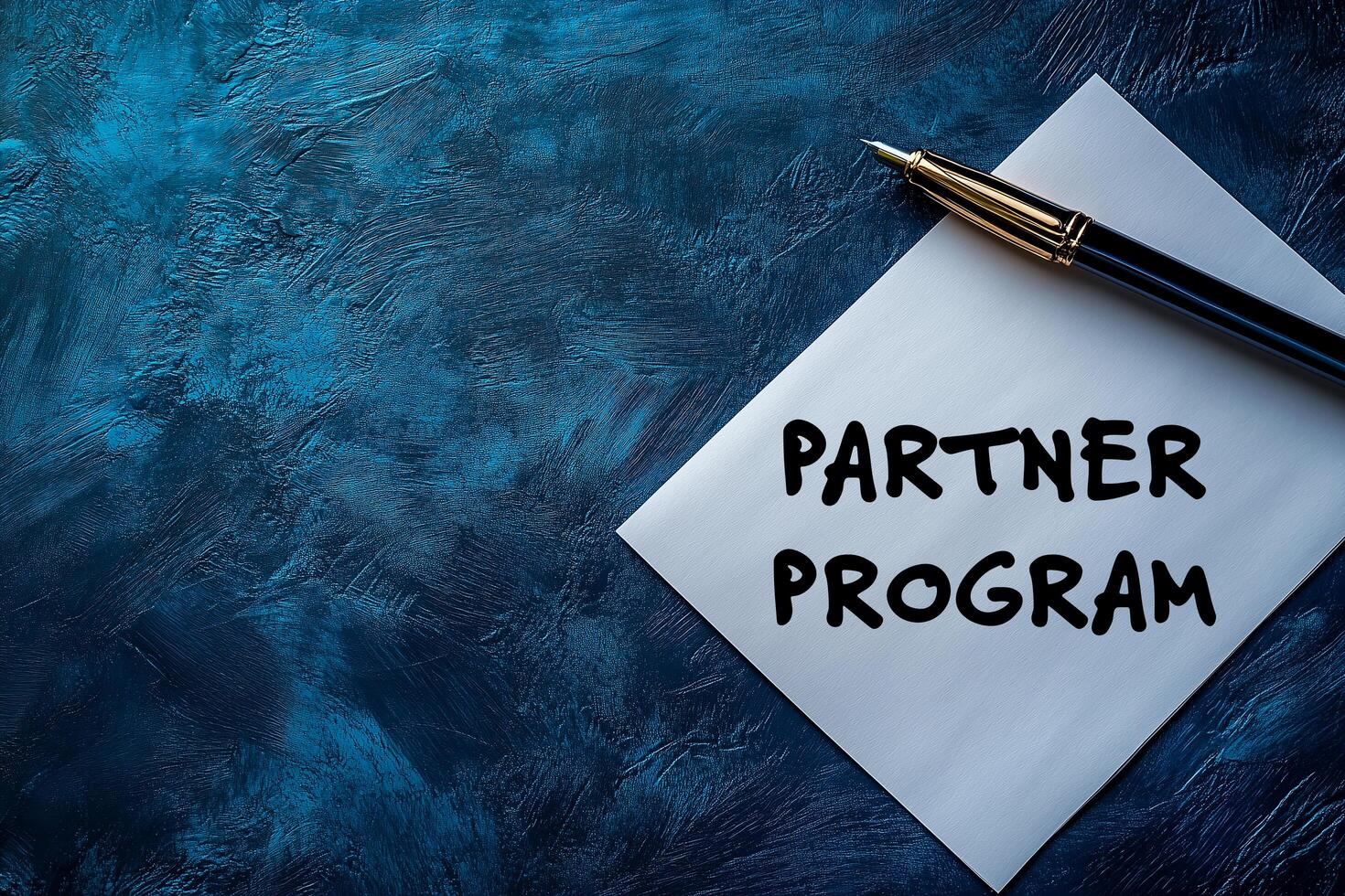 Partner program on paper with pen photo